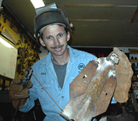 Tim Pace works on a piece in his studio.